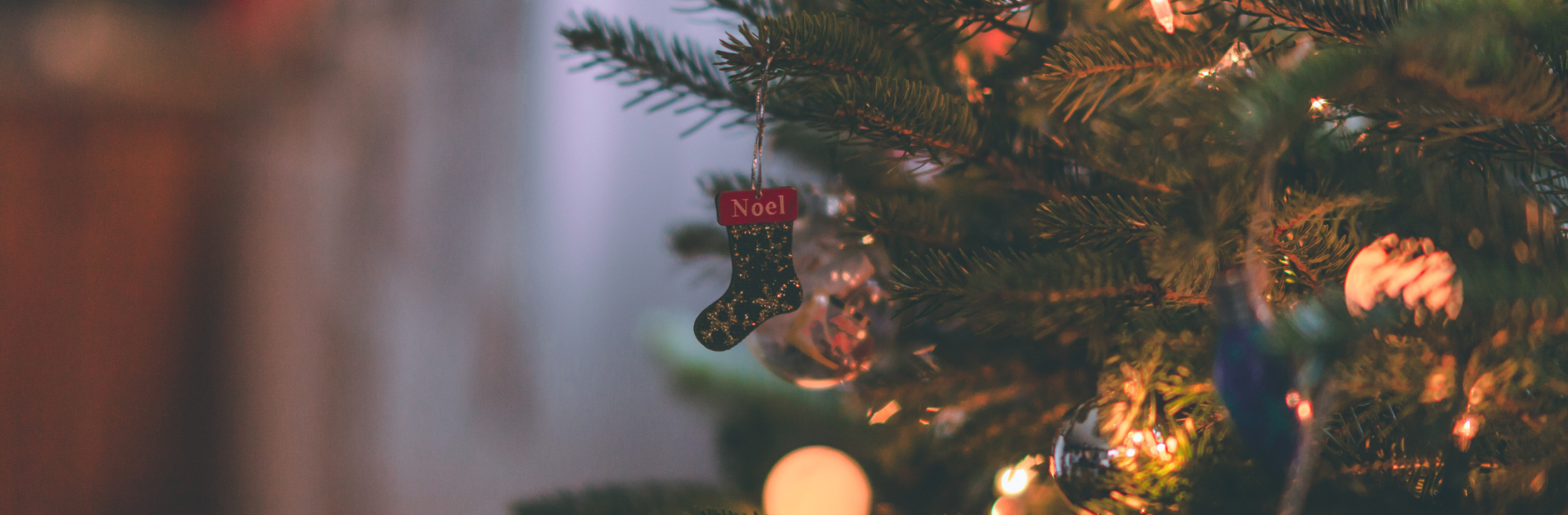 Christmas tree inside a home with lights and decorations