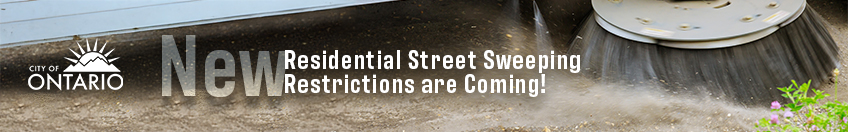 New Residential Street Sweeping Restrictions are coming. background of a street sweeper cleaning the street