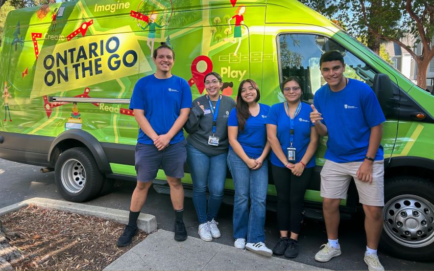 Ontario on the Go team members standing in front on the van